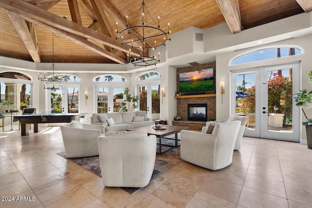 living room featuring plenty of natural light, french doors, high vaulted ceiling, and wood ceiling