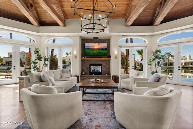 tiled living room featuring french doors, high vaulted ceiling, wood ceiling, and a wealth of natural light