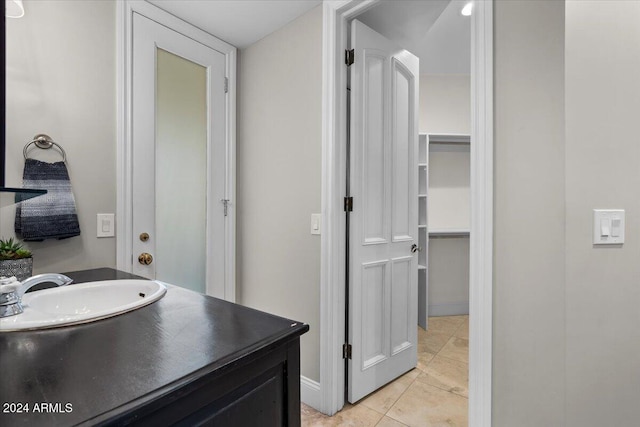 bathroom featuring vanity and tile patterned flooring