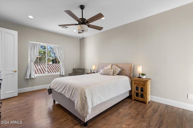 bedroom featuring dark hardwood / wood-style flooring and ceiling fan