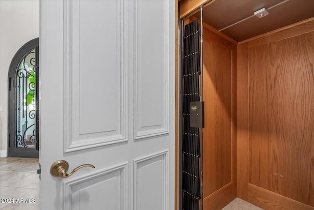 room details featuring tile patterned floors and elevator