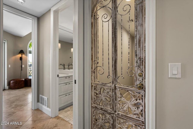 hallway with light tile patterned flooring