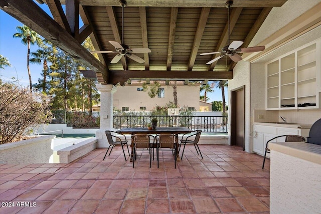 view of patio featuring sink and ceiling fan