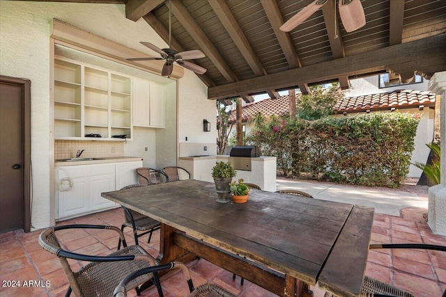 view of patio featuring sink, grilling area, and ceiling fan