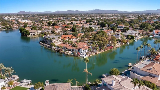 birds eye view of property featuring a water and mountain view