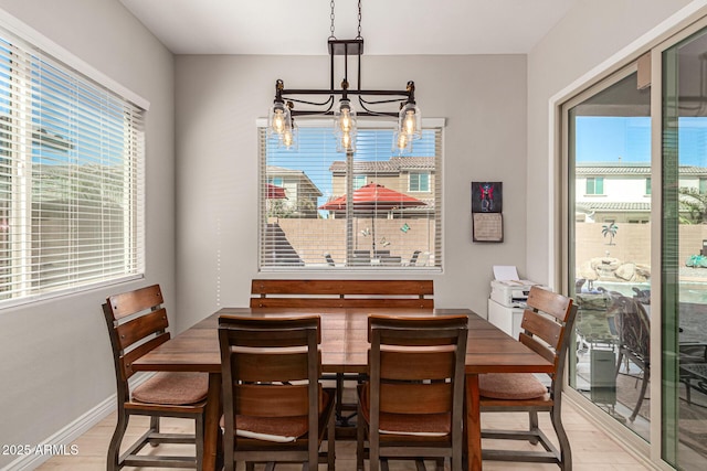 dining room with a notable chandelier