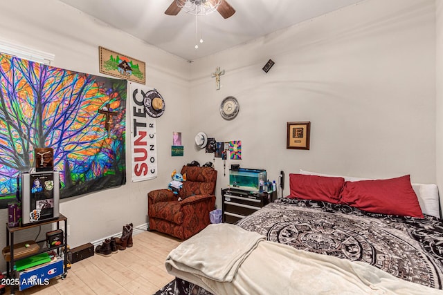 bedroom with hardwood / wood-style flooring and ceiling fan