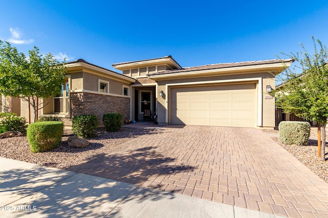 prairie-style house featuring a garage