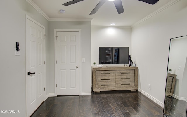 unfurnished bedroom featuring ornamental molding, ceiling fan, and dark wood-type flooring