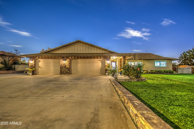 single story home with a garage and a front yard