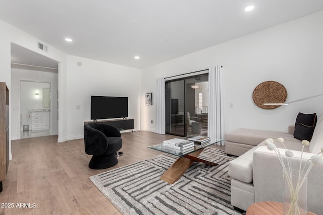 living room with light hardwood / wood-style floors