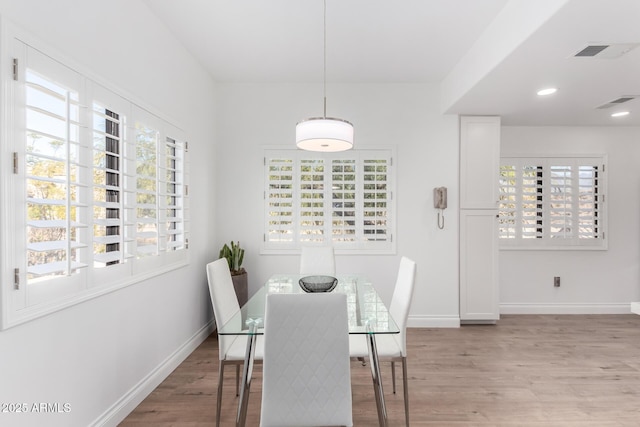 dining space featuring light hardwood / wood-style flooring