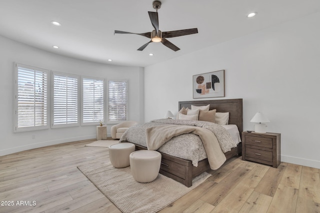 bedroom featuring ceiling fan, recessed lighting, light wood-style flooring, and baseboards