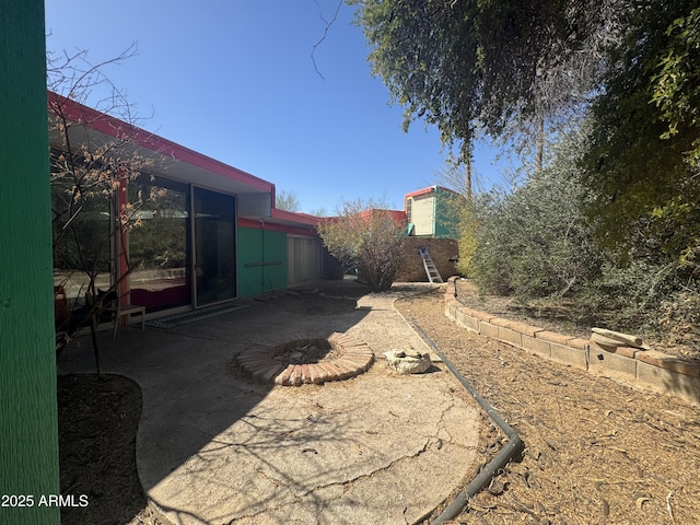 view of yard featuring a patio and fence