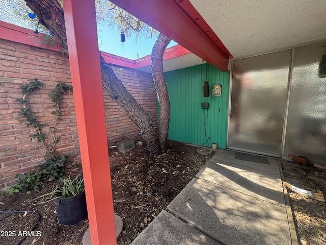 property entrance with brick siding