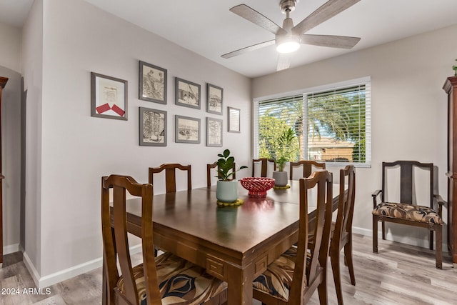 dining room with light wood-type flooring and ceiling fan