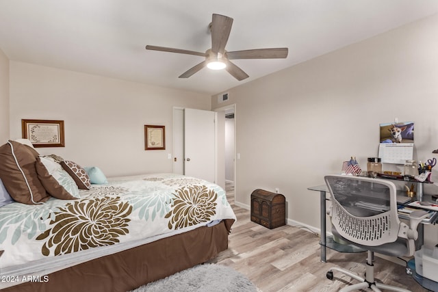 bedroom with ceiling fan and light hardwood / wood-style floors