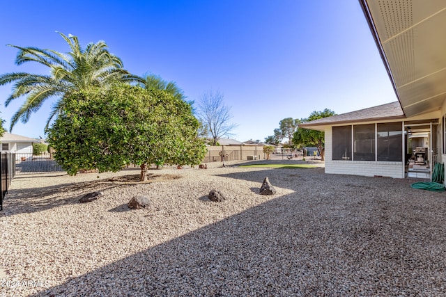 view of yard featuring a sunroom