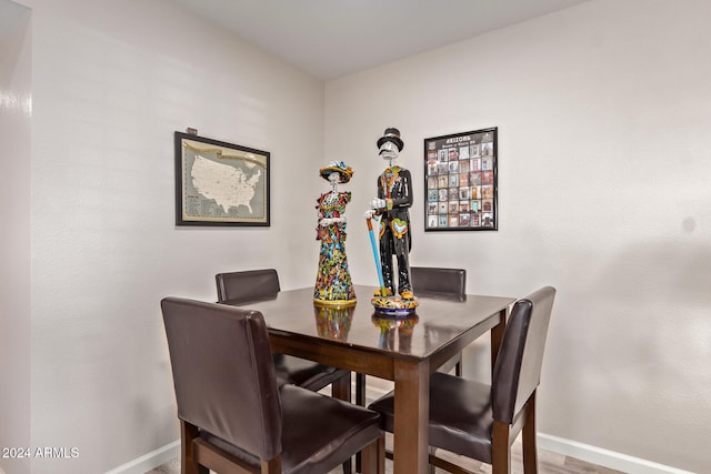 dining space featuring hardwood / wood-style flooring