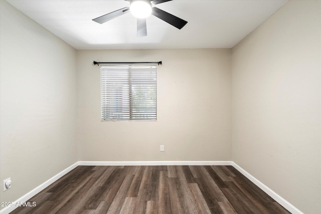 spare room with dark hardwood / wood-style floors and ceiling fan