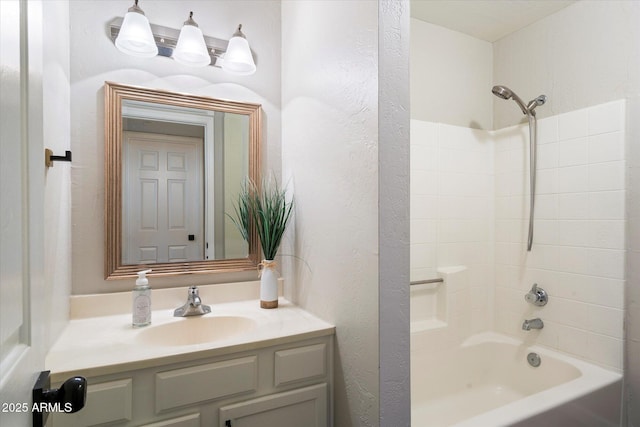 bathroom with vanity and  shower combination