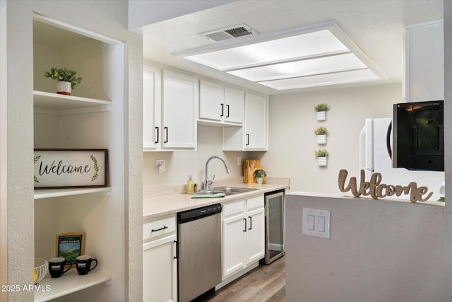 kitchen with light wood-type flooring, white cabinets, sink, dishwasher, and wine cooler