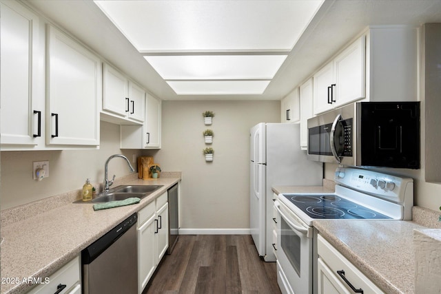 kitchen featuring dark hardwood / wood-style flooring, sink, white cabinets, and stainless steel appliances