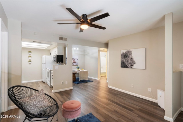 interior space featuring ceiling fan and dark wood-type flooring