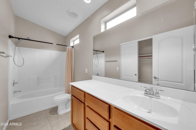 full bathroom featuring tile patterned floors, shower / bath combination with curtain, lofted ceiling, toilet, and vanity