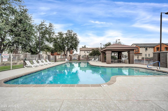 view of swimming pool with a gazebo and a patio area