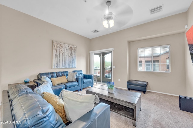 living room featuring light carpet and ceiling fan