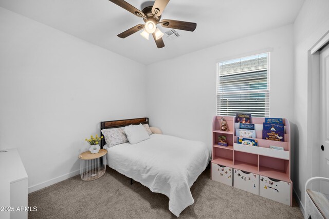 bedroom with baseboards, ceiling fan, carpet flooring, and visible vents
