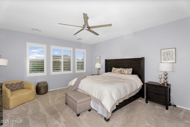 bedroom featuring visible vents, baseboards, ceiling fan, and carpet floors