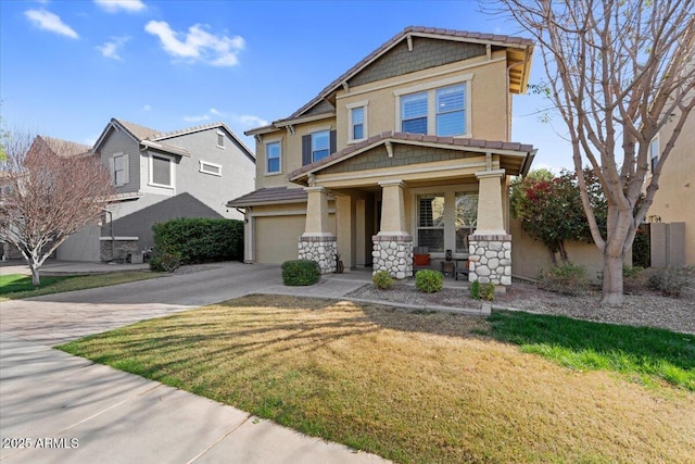 craftsman house with stucco siding, driveway, a front lawn, stone siding, and an attached garage