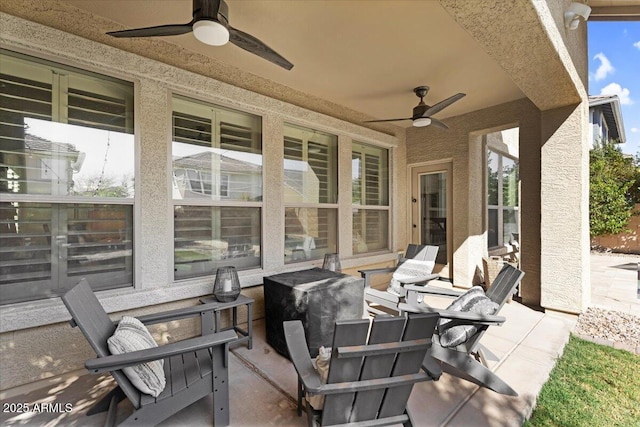 view of patio / terrace featuring ceiling fan