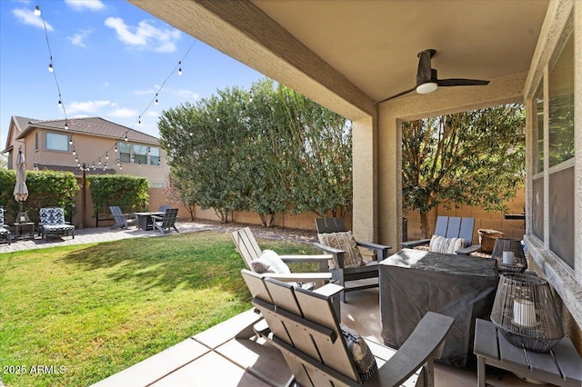 view of patio / terrace featuring a fenced backyard and a ceiling fan