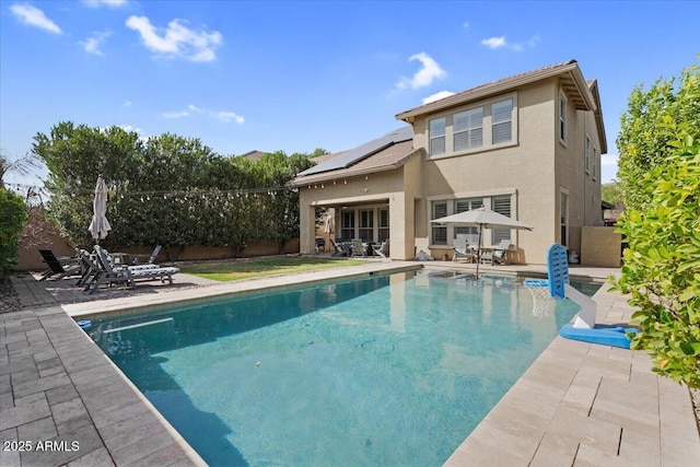 view of pool featuring outdoor dining area, a patio area, a fenced in pool, and a fenced backyard