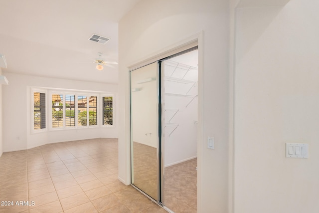 hallway with light tile patterned floors