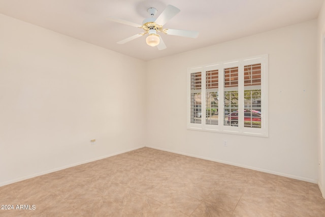 spare room with ceiling fan