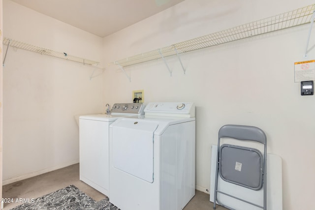 clothes washing area featuring independent washer and dryer