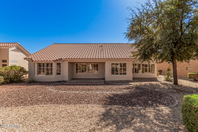 rear view of house featuring a patio area