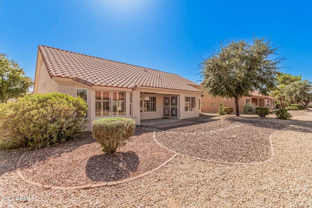 rear view of property with a patio area