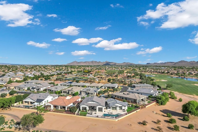 drone / aerial view with a residential view, a water and mountain view, and golf course view