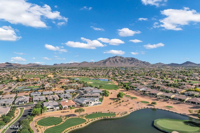 aerial view featuring a residential view, a water and mountain view, and golf course view