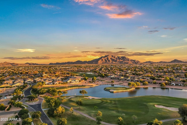 aerial view featuring a residential view, view of golf course, and a water and mountain view
