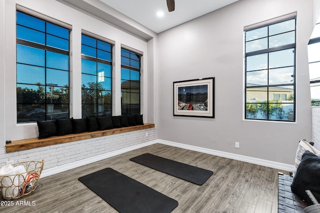workout room featuring baseboards, ceiling fan, recessed lighting, and wood finished floors