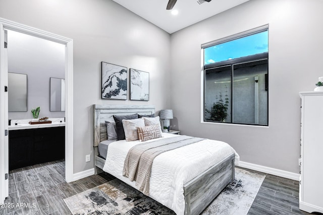 bedroom featuring baseboards, connected bathroom, ceiling fan, and wood finished floors