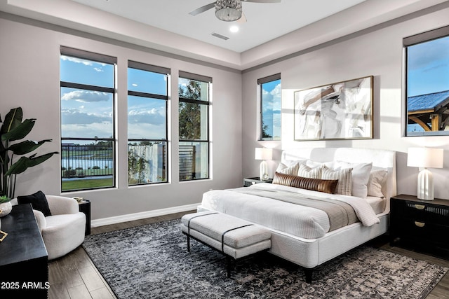 bedroom with visible vents, recessed lighting, baseboards, and wood finished floors