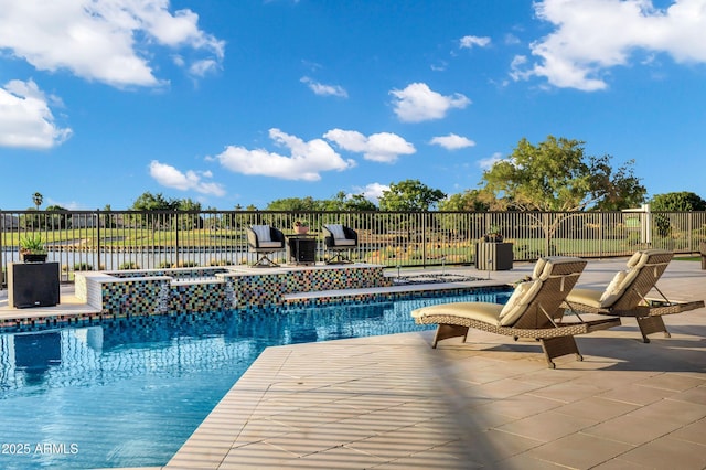 view of pool with a fenced in pool, fence, a patio, and an in ground hot tub