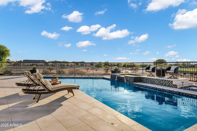 view of pool featuring a patio, a pool with connected hot tub, and fence